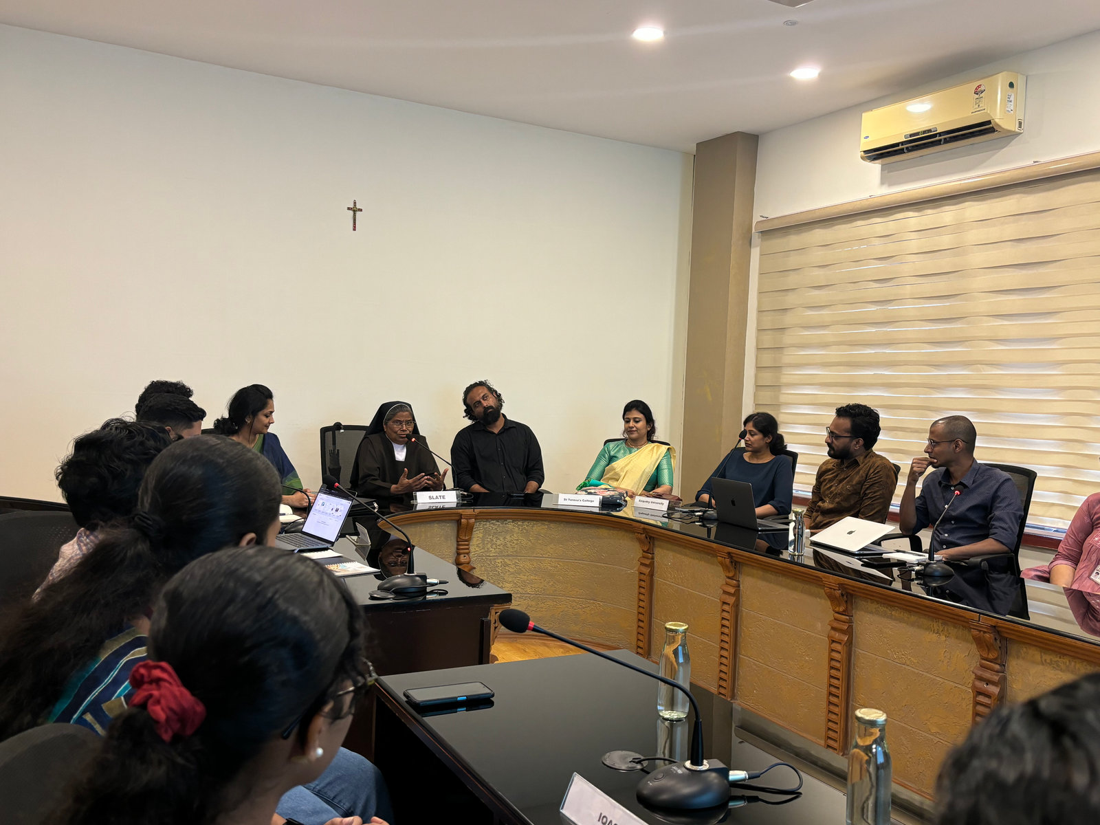 Partners around a conference table at a S.L.A.T.E roundtable